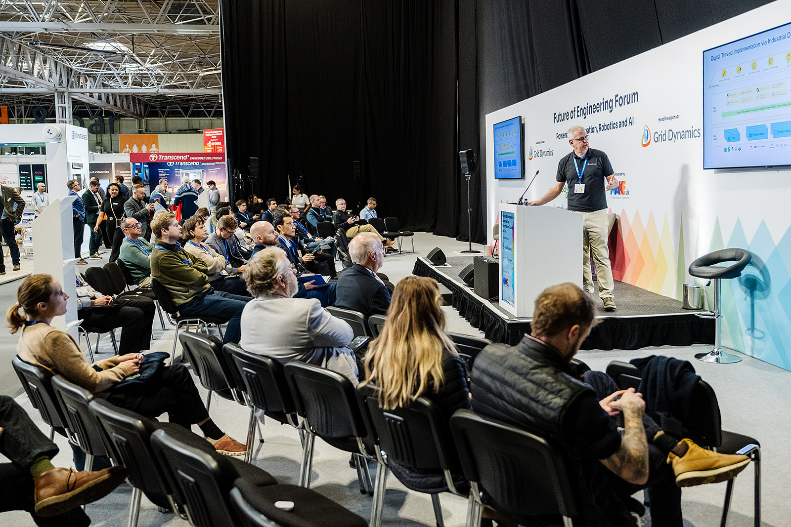 A speaker addressing a seated audience at the Future of Engineering Forum at Advanced Engineering, NEC Birmingham