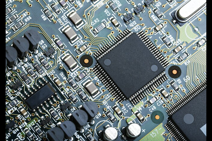 closeup-electronic-circuit board with cpu microchip electronic components background